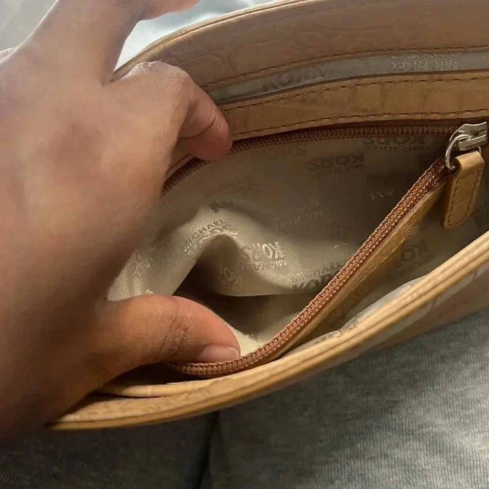 Tan Michael Kors envelope chain crossbody purse with adjustable straps